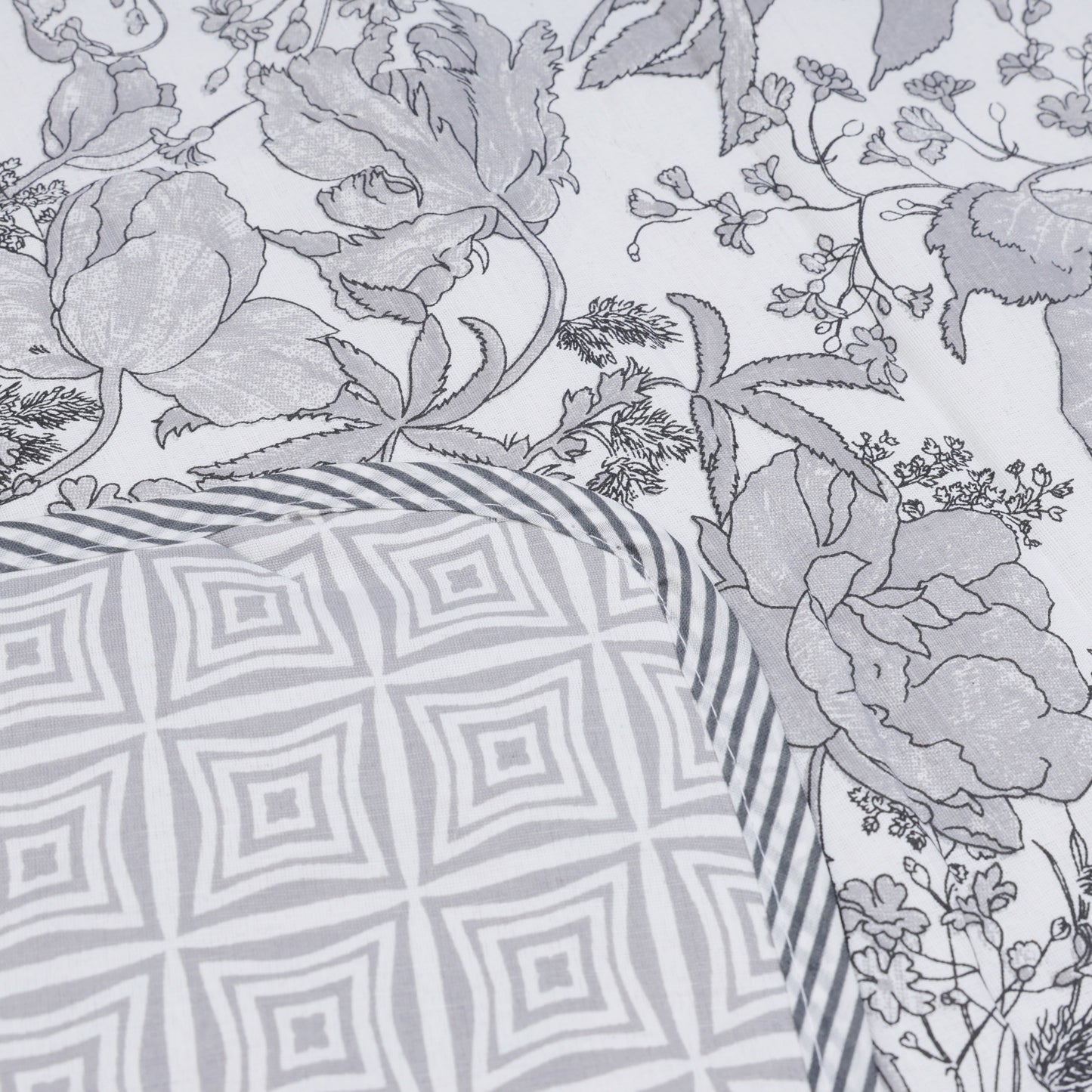 PREMIUM ORGANIC COTTON REVERSIBLE DOHAR - THREE-LAYERED BOTANICAL & GEOMETRIC PATTERN WITH SLATE HUE AND INSULATING FALTEN FOR ALL-WEATHER COMFORT.